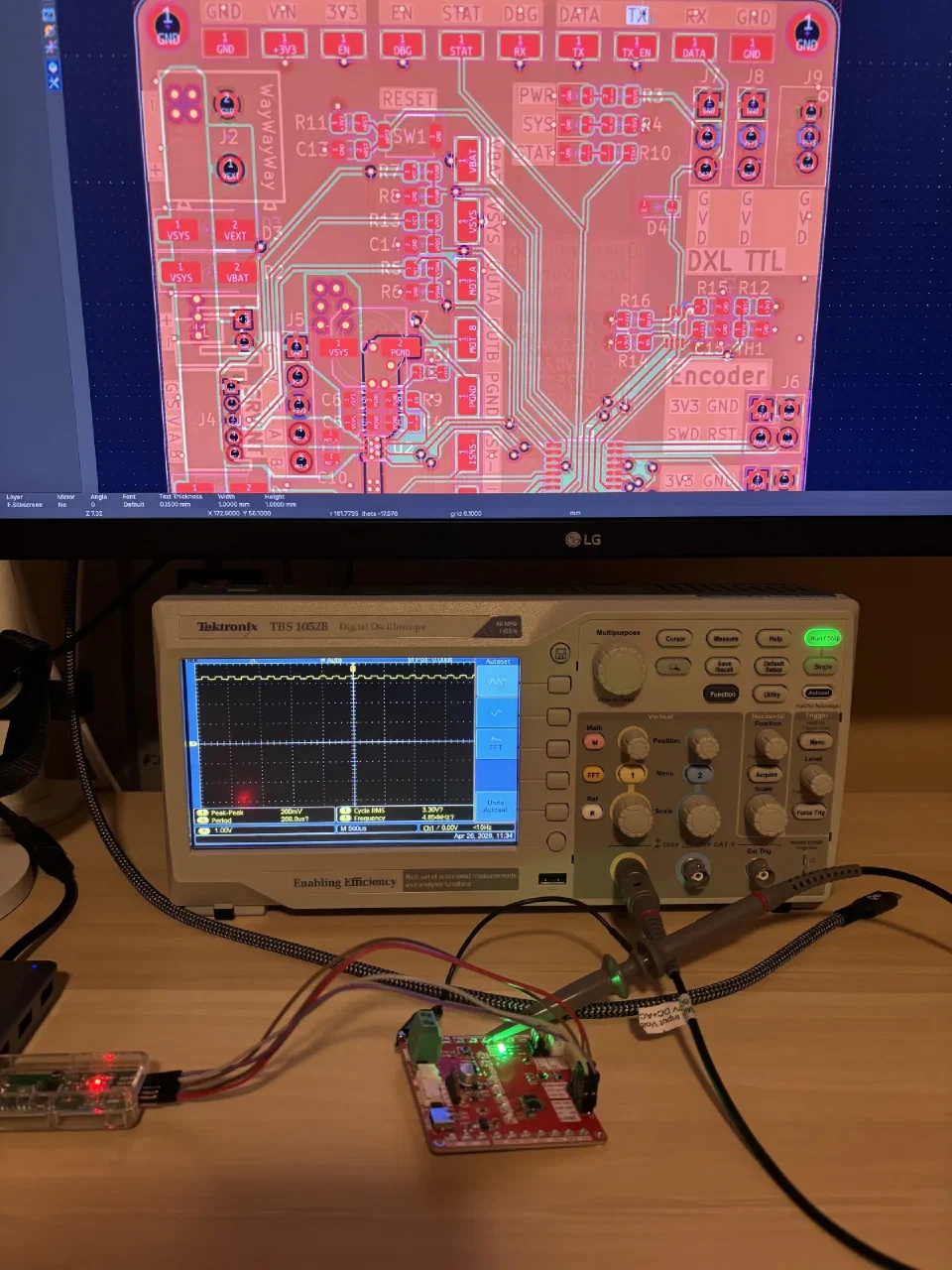 Bench setup with the dev board, scope hooks on RX, and the PCB layout I kept re-checking