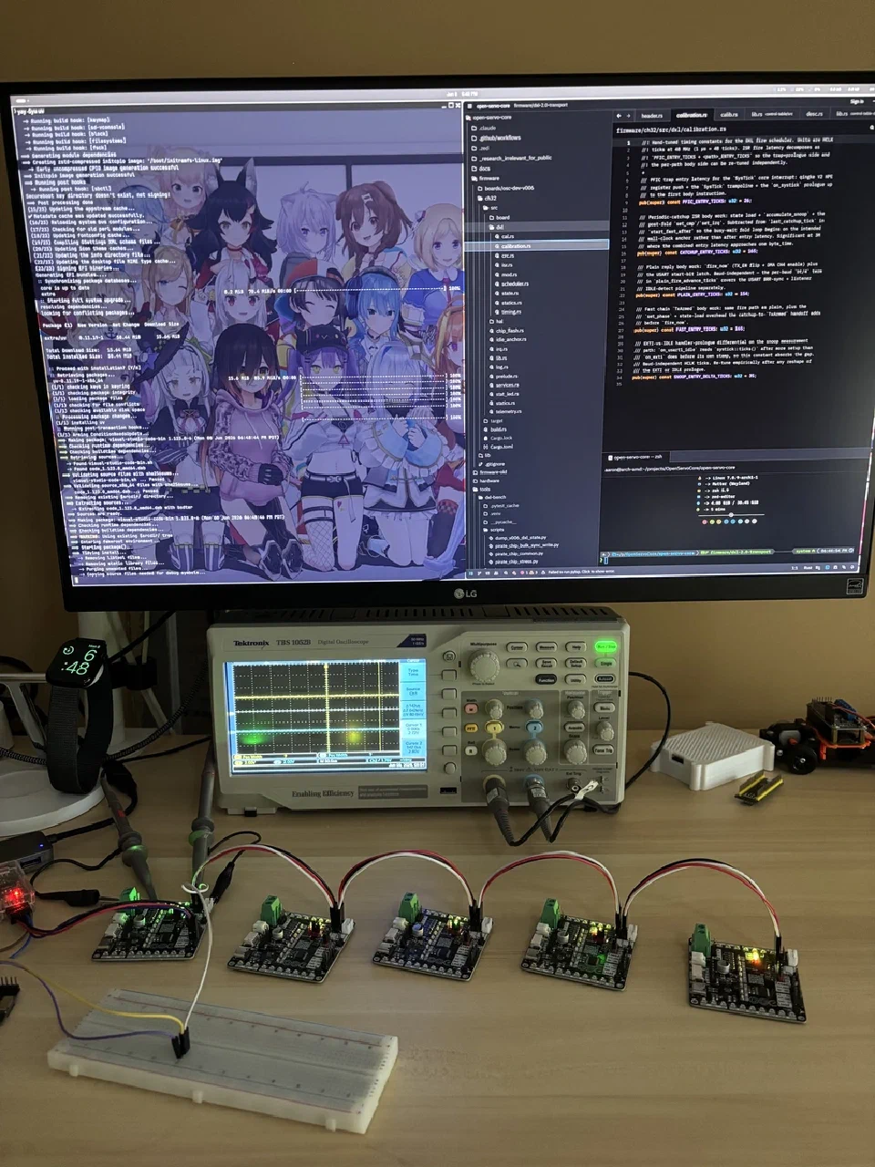 Five Rev B boards chained on the DXL bus during comms testing